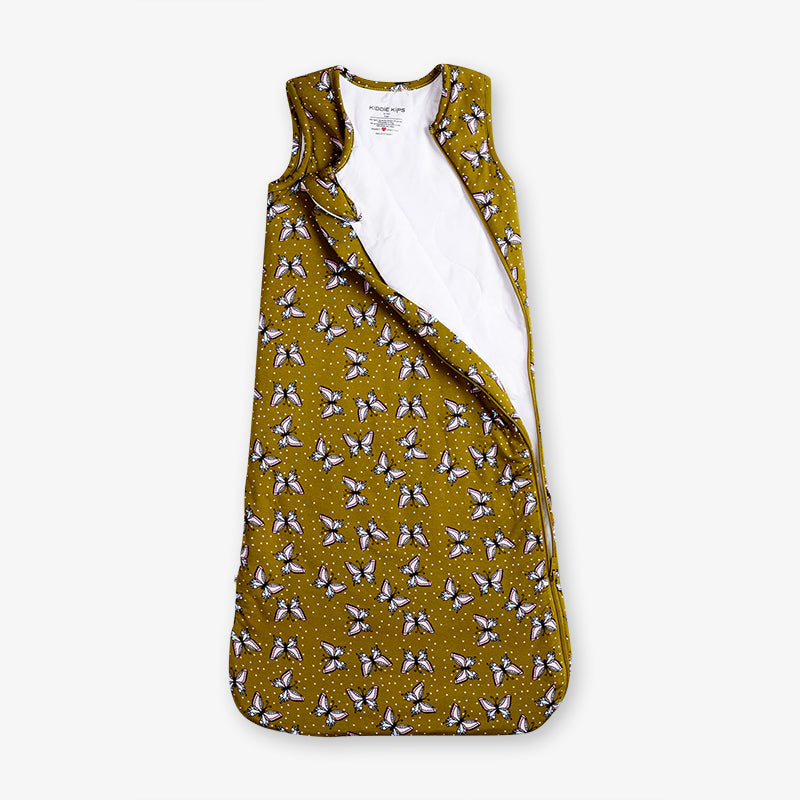 Yellow sleeveless top with butterfly pattern on a white background